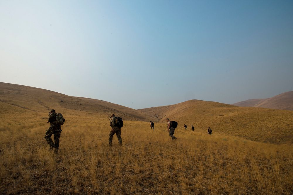 U.S. Air Force Reserve Officer Training Corps Cadets walk towards their designated location at Yakima Training Center in…