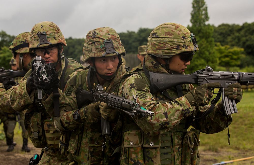 Japan Ground Self-Defense Force soldiers prepare to enter a building during military operations on urbanized terrain, Aug.…