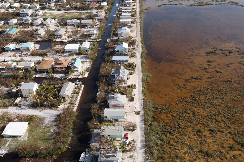 A ravaged neighborhood in the Florida Keys now fronts a brown, murky, seascape tainted by Hurricane Irma as seen from a U.S.…