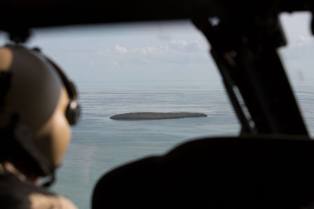 One of many islands of the Florida Keys appears in the forward window of a U.S. Customs and Border Protection Air and Marine…