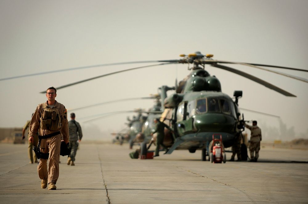 U.S. Air Force Capt. Bryan Tuinman, an Mi-171 helicopter pilot with the 721st Air Expeditionary Advisory Squadron, walks…