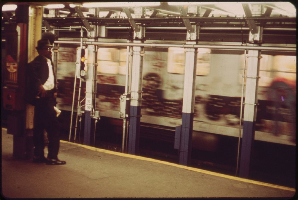 Man Backs Away from Roar of Subway Train, 05/1973. Original public domain image from Flickr