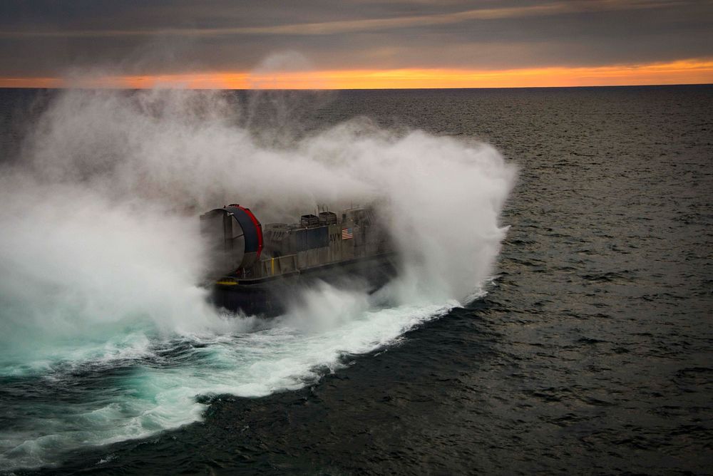 Landing Craft, Air Cushion 71, attached to Assault Unit 4, departs the amphibious assault ship USS Iwo Jima (LHD 7) in the…