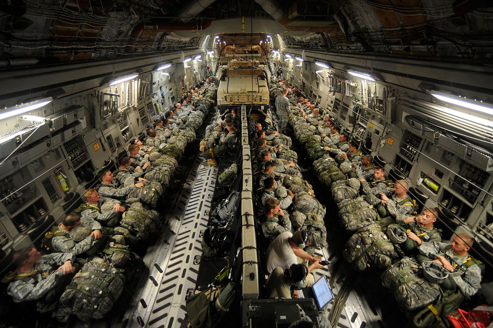 U.S. Soldiers from the 82nd Airborne Division ride in an Air Force C-17 Globemaster III aircraft Aug. 26, 2009, for the air…