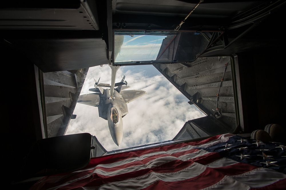 United States Air Force F-22 Raptor receives fuel from a KC-10 Extender over Syria, during a mission in support of Operation…
