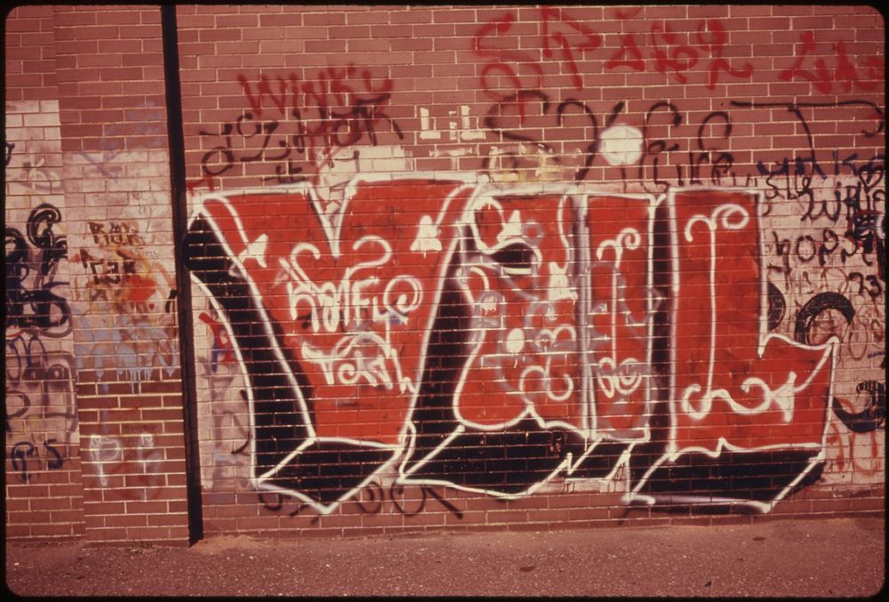 Graffiti with a Supergraphic "Vail" and Other Words on a Wall in Brooklyn, New York City. The Inner City Today Is an…