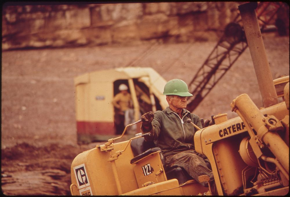 Dragline and Workers at Site of Oil Spill Clean - Up Operations on the San Juan River in Monument Valley, Utah, 10/1972.…