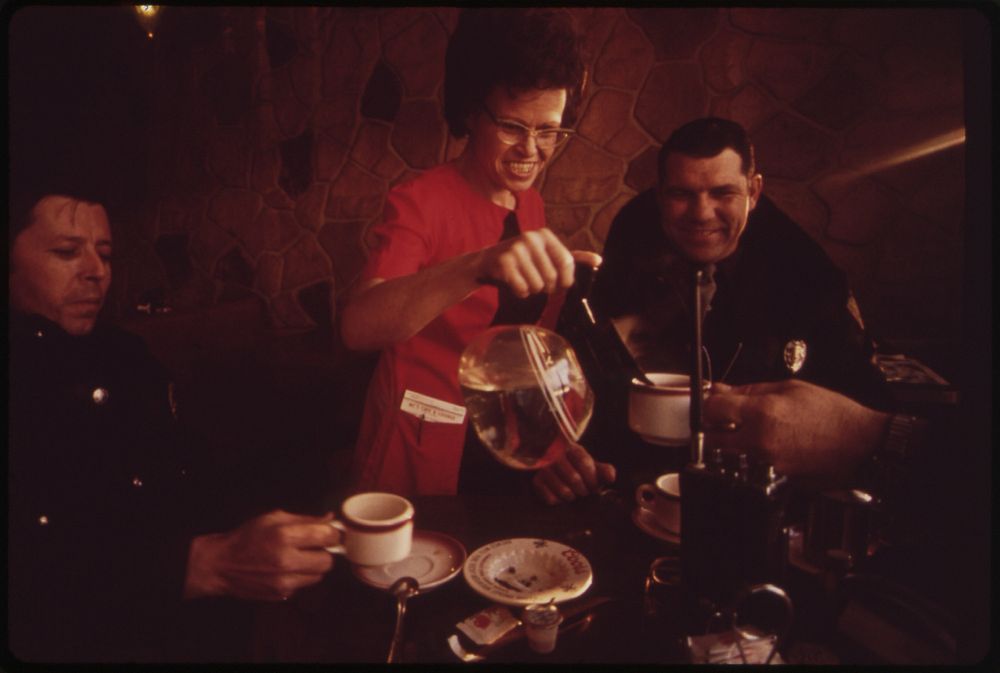 After a Cold Morning of Patrol Duty Police Officer Shearer and Chief Allec Enjoy Hot Coffee at Mac's Cafe, 01/1973. Original…