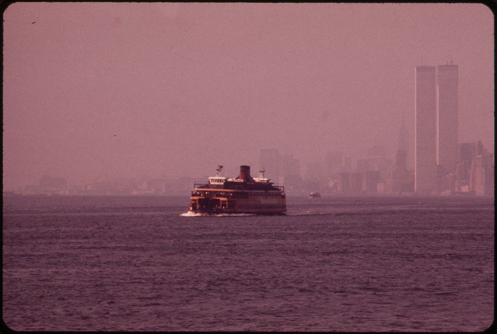 Staten Island Ferry with Smog-Obscured Skyline of Lower Manhattan in Background. on the Right Are the Twin Towers of the…