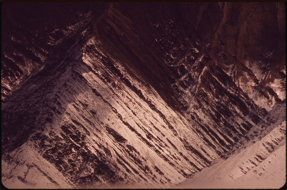 Tilted Horizontal Bedding of Rock Strata on the West Side of the Atigun Valley 08/1973. Photographer: Cowals, Dennis.…