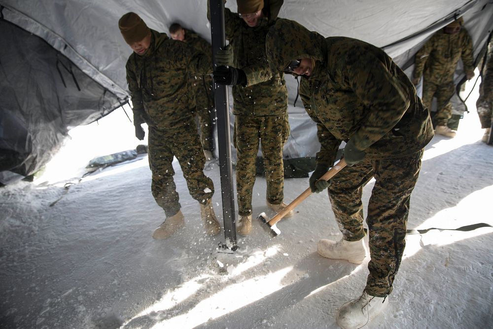 Marines with Combat Logistics Regiment 25 set up a logistics tent at Fort Greely, Alaska in preparation for Exercise Arctic…
