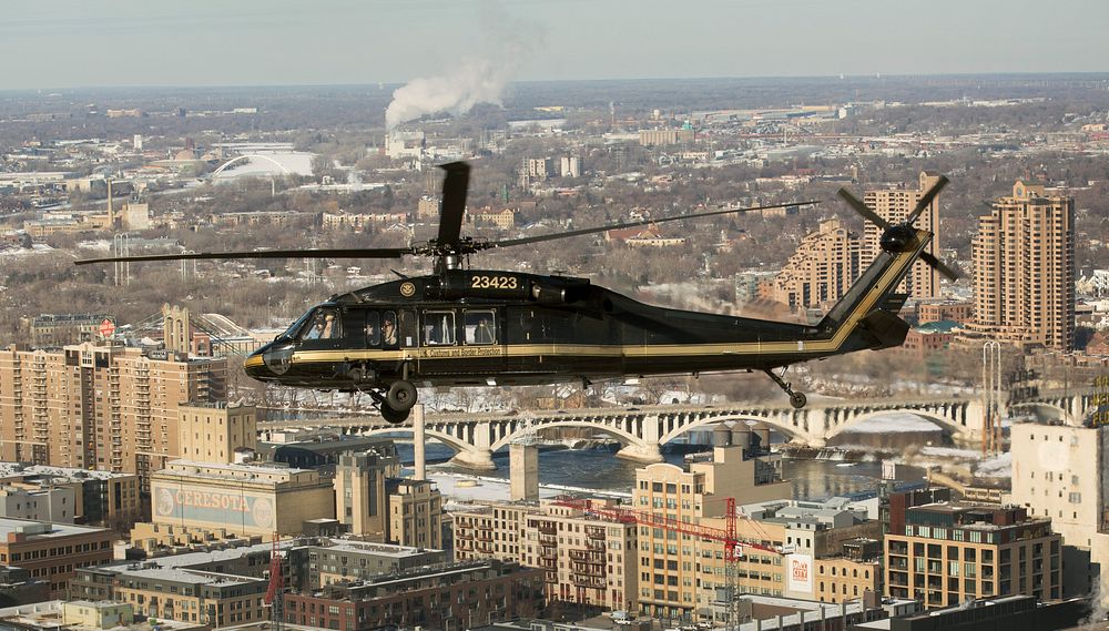 A U.S. Customs and Border Protection, Air and Marine Operations, UH-60 Black Hawk helicopter flies over Minneapolis…