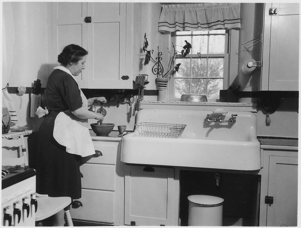 Woman Cooking in a Kitchen. Original public domain image from Flickr