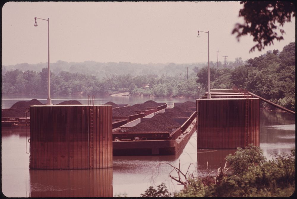 Coal Barges Tied Up on the Cumberland River Waiting to Be Unloaded by Automated Equipment at the Tennessee Valley Authority…