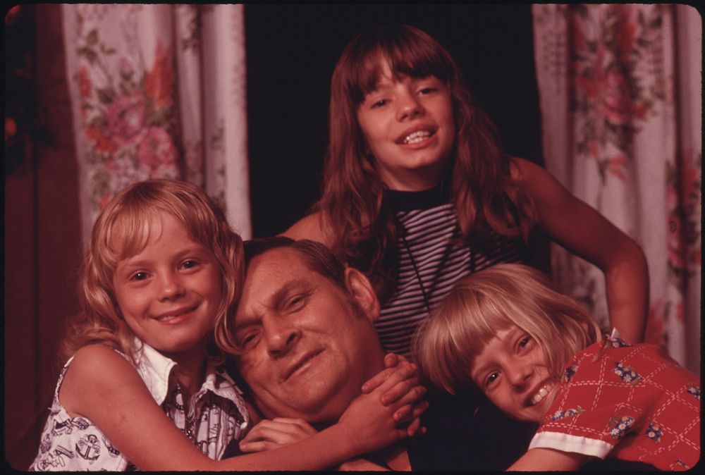 Closeup of Jack Smith, 42, Disabled Miner From Rhodell, West Virginia, near Beckley, with Three of His Four Daughters.