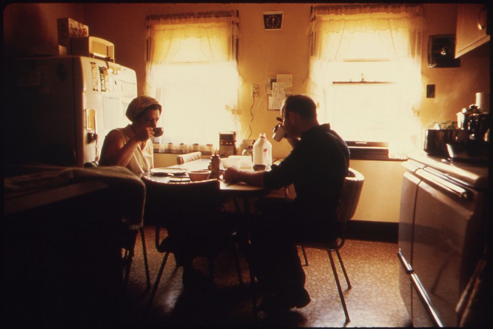 Mr. And Mrs. Wallace A. Wolf Eating Breakfast before He Leaves for His Job as an Automotive Mechanic for the City. He Is a…