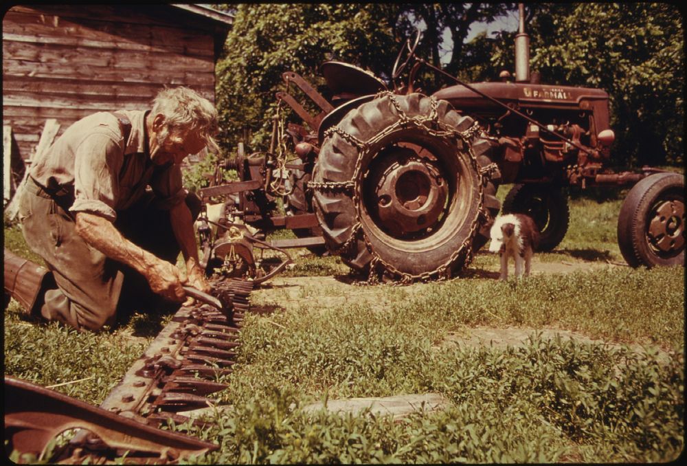 A 60-Year-Old Bachelor Farmer from Beanville, near Randolph, Vermont, Adjusts the Blades of His Mower before Going Out to…