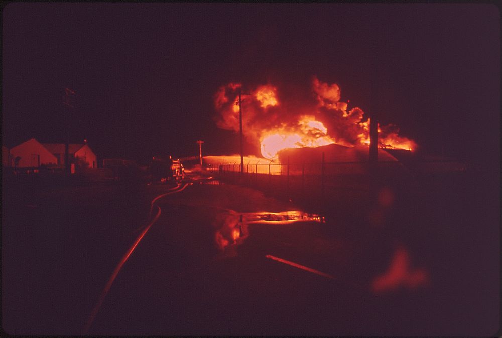 A Texaco Crude Oil Tank Blazes Against the Night after Being Struck by Lightning, 05/1972. Photographer: Olive, Jim.…