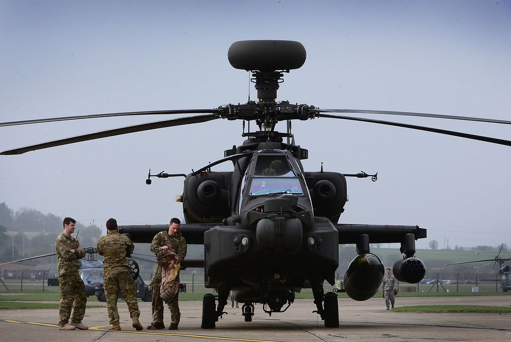 A British Army Apache AH1 Mk1 attack helicopter aircrew assigned to the British Army Air Corps Air Squadron 663 arrive at…