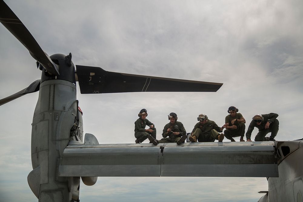 U.S. Marines with the Aviation Combat Element, Marine Rotational Force – Darwin, conduct maintenance on an MV-22 Osprey…