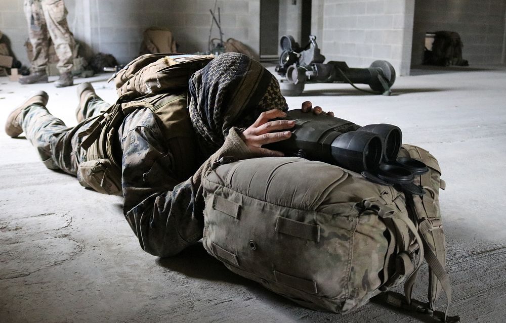 A U.S. Marine with the 3rd Air Naval Gunfire Liaison Company, Bell, California, prepares to conduct a training exercise…