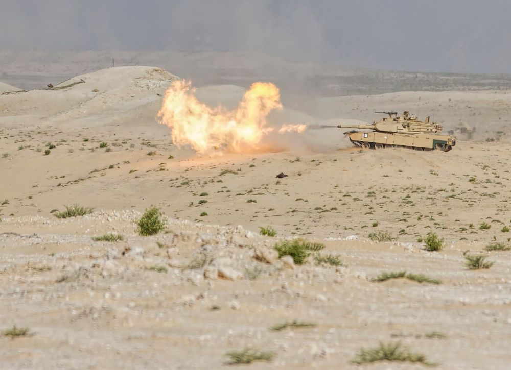 A U.S. Army M1 Abrams tank from 2nd Brigade Combat Team, 1st Armored Division, Fort Bliss, Texas fires a 120mm round during…