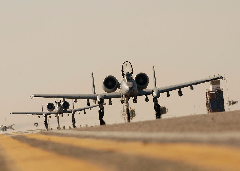 Two U.S. Air Force A-10C Thunderbolt II aircraft from the 354th Expeditionary Fighter Squadron taxi at Kandahar Air Field…