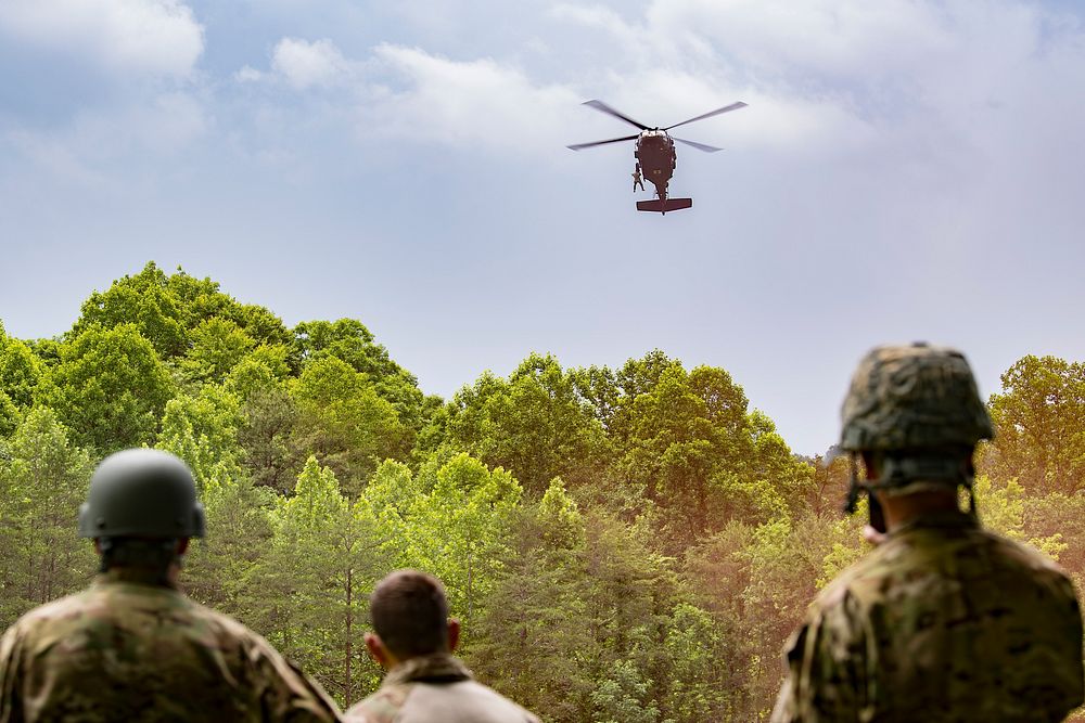 U.S. Airmen assigned to the 130th Operations Group look on as an Army UH-60 Black Hawk assigned to Charlie Company, 2nd…