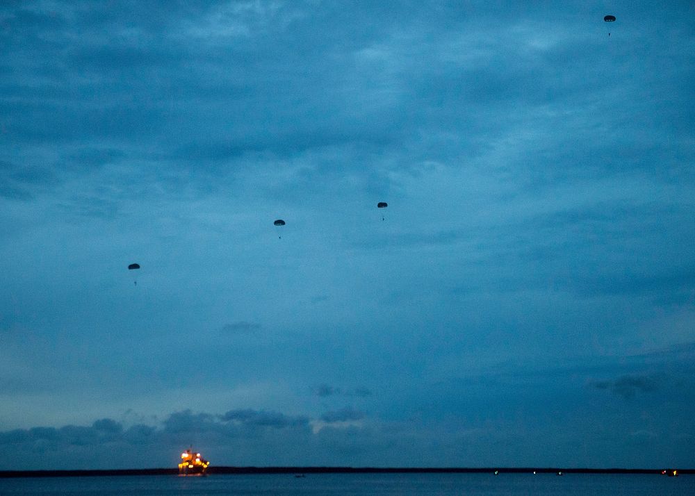 U.S. Sailors attached to Explosive Ordnance Disposal Mobile Unit (EODMU) 5 participate in a static line jump exercise in…