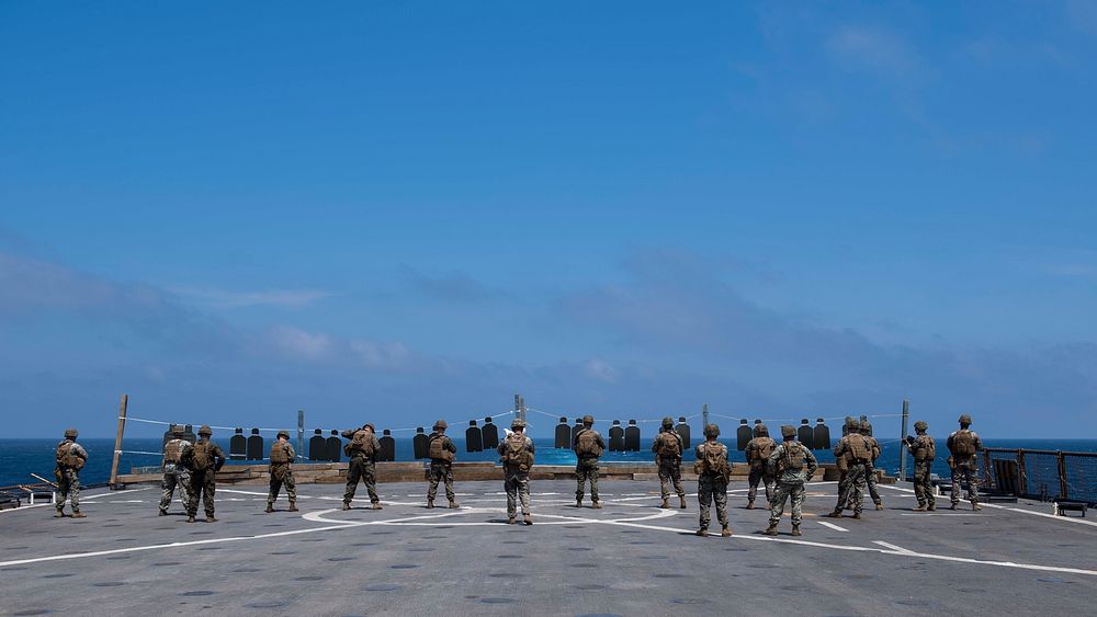U.S. Marines assigned to the 26th Marine Expeditionary Unit (MEU), participate in a small arms gun shoot qualification on…