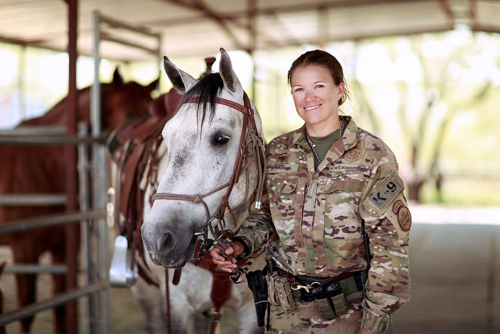 USBP Agent with patrol horse after returning to Tucson Station’s horse coral following a track and trail operation near…