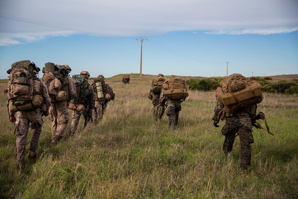 U.S. Marines with Special Purpose Marine Air-Ground Task Force-Crisis Response-Africa and Spanish marines move toward a…