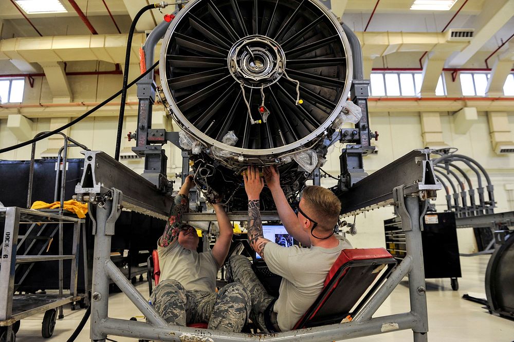 U.S. Airmen assigned to the 18th Component Maintenance Squadron repair and engine from an F-15 Eagle aircraft Oct. 12, 2018…