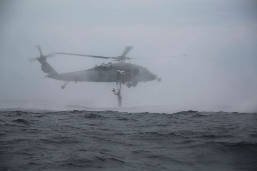 U.S. Marines with the 31st Marine Expeditionary Unit’s Amphibious Reconnaissance Platoon exit a U.S. Navy MH-60S Seahawk…