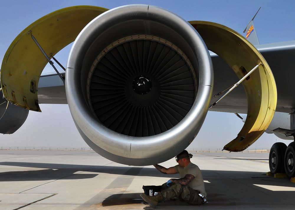 A U.S. Airman from the 451st Expeditionary Aircraft Maintenance Squadron performs maintenance on a KC-135 Stratotanker…