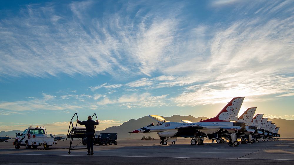 U.S. Airmen assigned to the United States Air Force Air Demonstration Squadron Thunderbirds prepare F-16 Fighting Falcon…