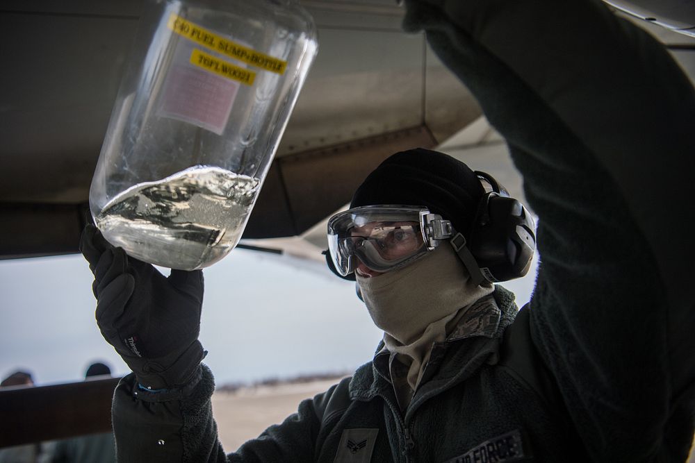 Airman First Class Anthony Uelk, flight line crew chief, 932nd Maintenance Group, uses a fuel sump bottle to check for any…
