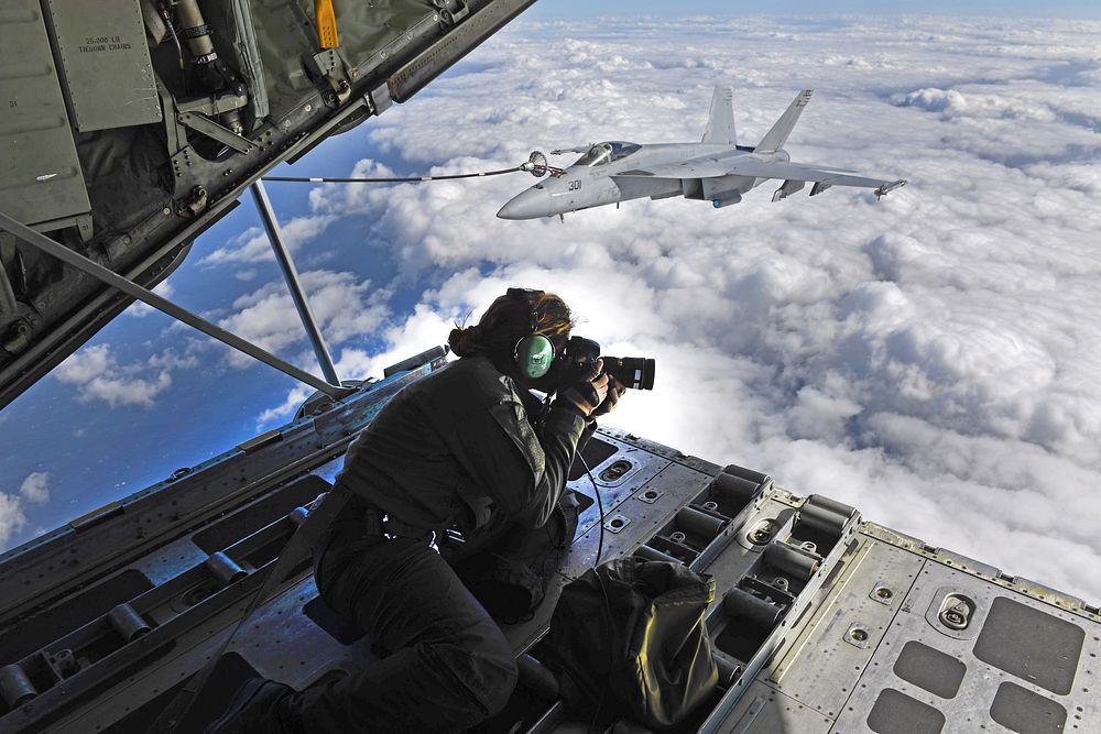 U.S. Navy Chief Mass Communication Specialist Shannon E. Renfroe photographs F/A-18E Super Hornets from Strike Fighter…