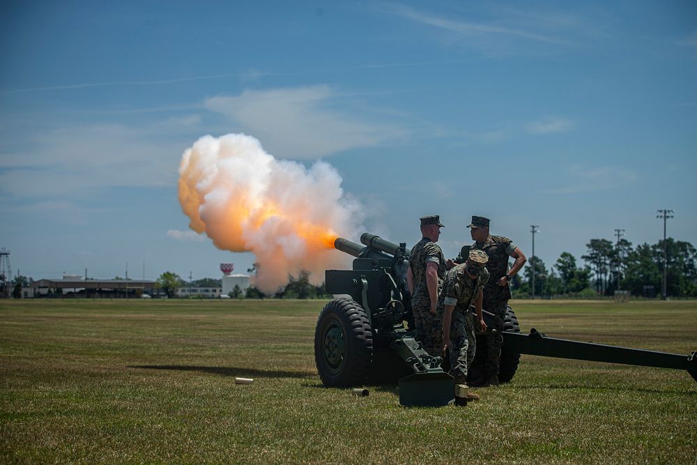 U.S. Marines with Echo Battery, 2nd Battalion, 10th Marine Regiment, 2nd Marine Division, host a 21-Gun Salute on Camp…