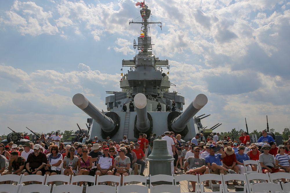 Crowd members find their seats before the 58th annual Memorial Day Observance ceremony aboard the USS North Carolina in…