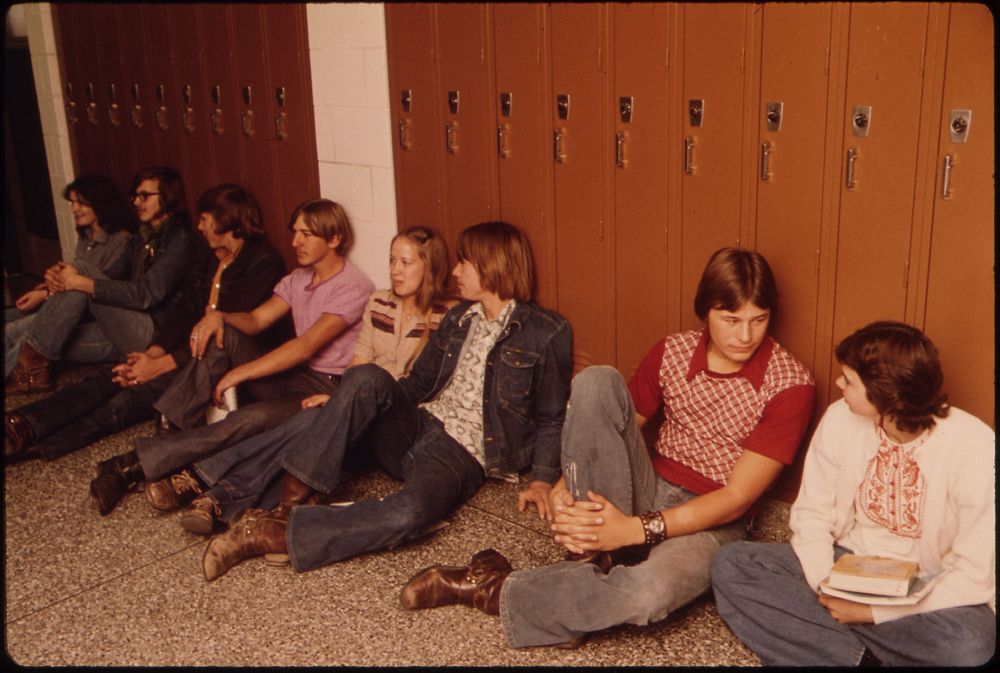 Students Resting in the Hall Against Their Lockers Waiting for Class at Senior High School in New Ulm, Minnesota.