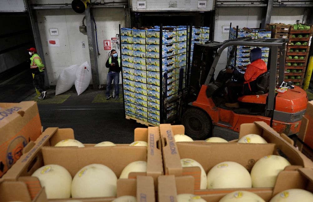 Pallets with imported fruit await distribution to retail providers in a warehouse at Penn Terminals in Eddystone, Pa., April…