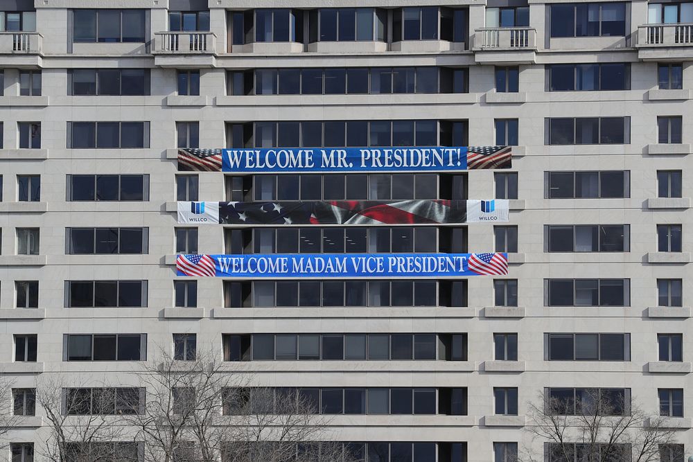 Banners hang from a building welcoming the incoming President Joseph R. Biden and Vice President Kamala Harris as U.S.…