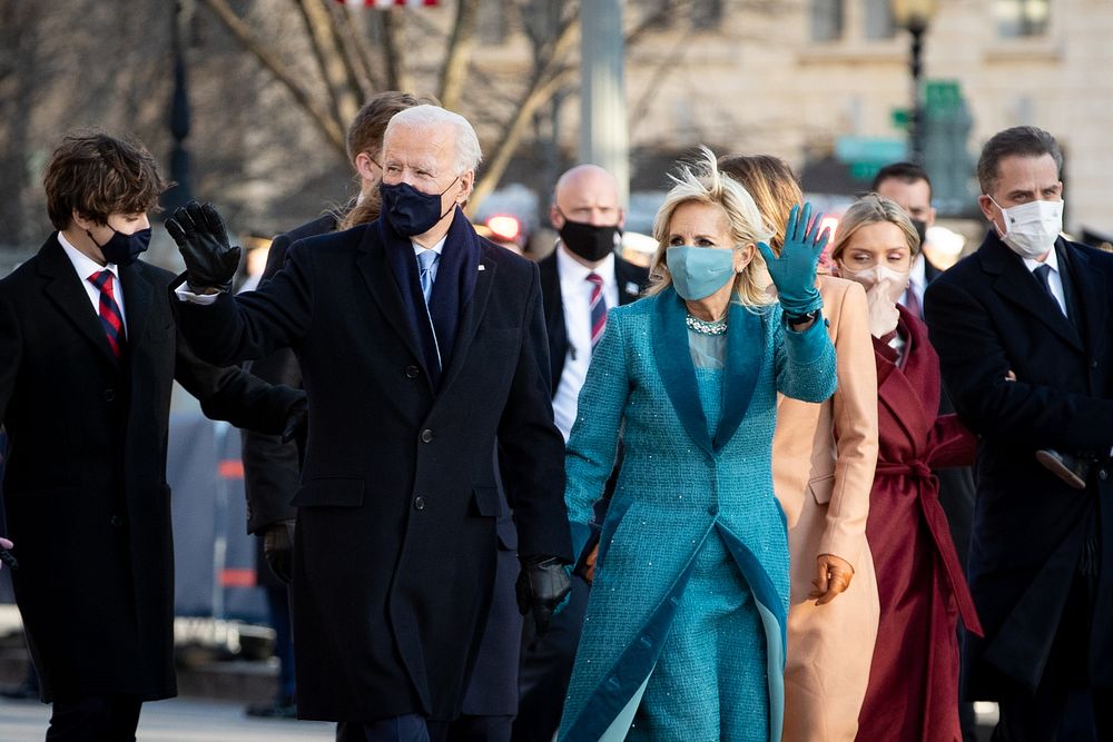 President Joe Biden and his family walk to the White House on Pennsylvania Avenue on January 20, 2021.