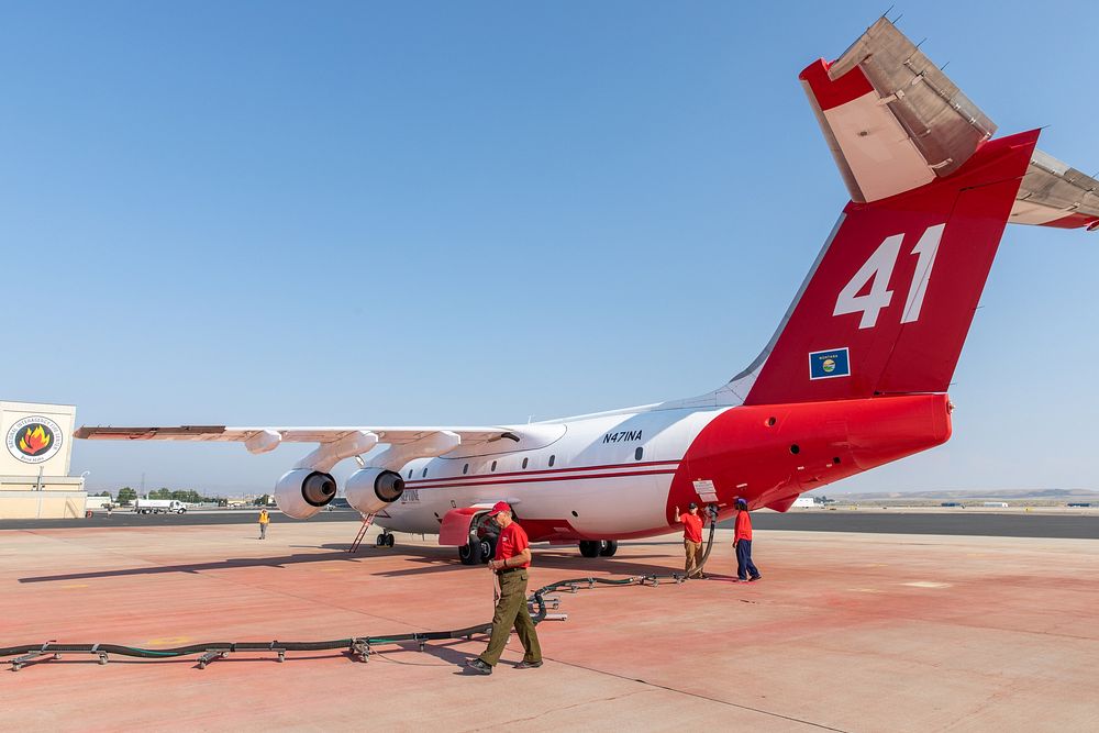 A ground crew loads fire retardant into an air tanker at the Boise Tanker Base. (DOI/Neal Herbert).