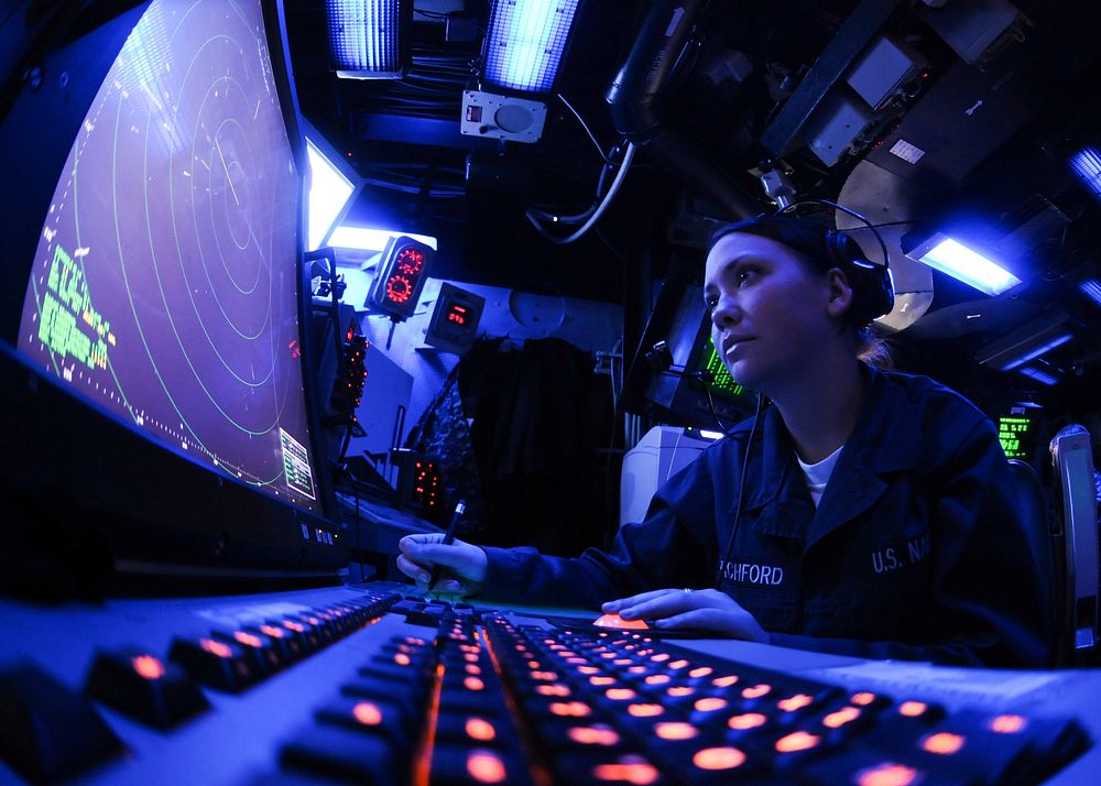U.S. Navy Air Traffic Controller Airman Chelsea Pitchford monitors an air approach radar console in the air traffic control…