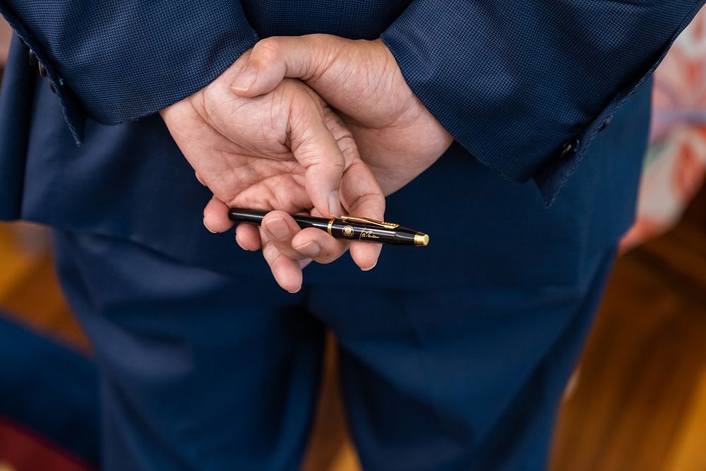 U.S. Rep. Mark Takano, D—Calif., holds a pen that President Joe Biden used to sign the Dispose Unused Medications and…