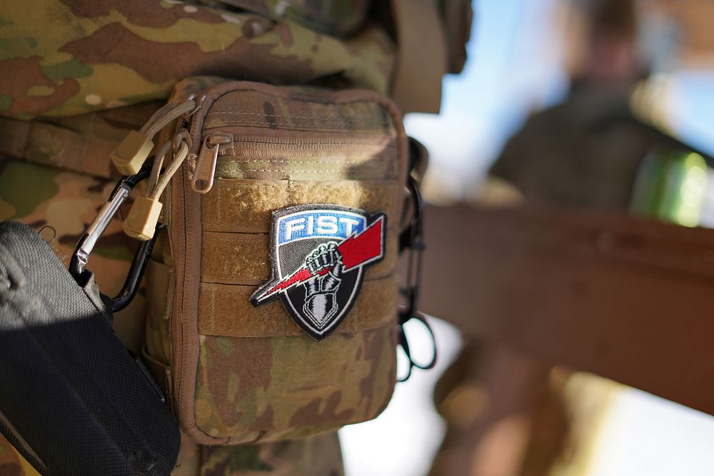 A Fire Support Team patch is seen attached to a camouflage pouch on a paratrooper assigned to the 2nd Battalion, 377th…