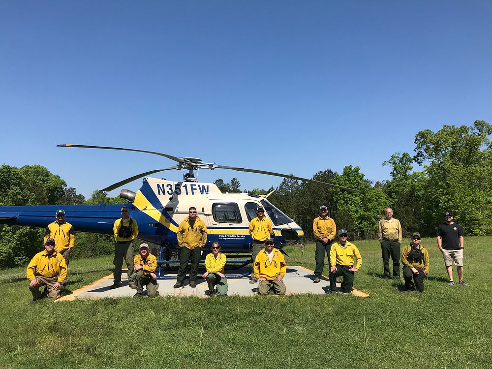 2021 USFWS Fire Employee Photo Contest Category: AircraftZone 2 USFWS Firefighters pose for a photo with the USFWS…