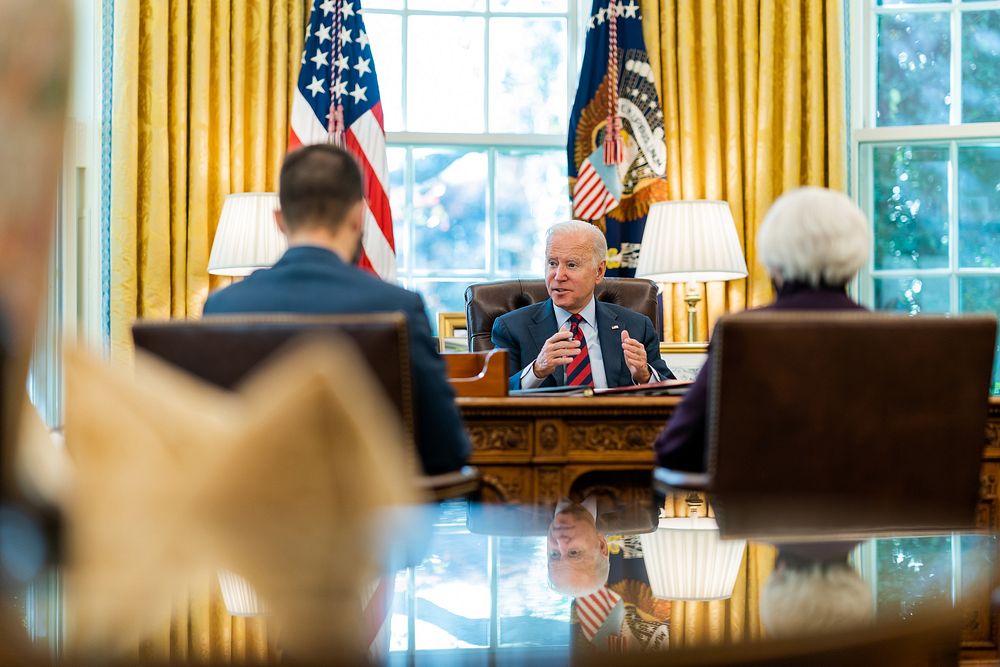 President Joe Biden meets with advisers before a phone call to Speaker of the House Nancy Pelosi (D-Calif.) and Senate…